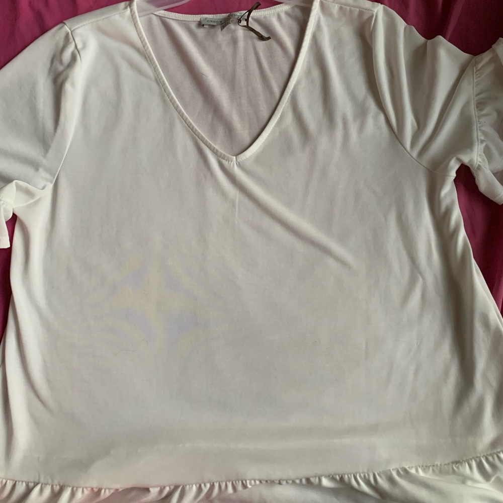 White V neck blouse.